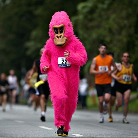 Person in pink money suit running