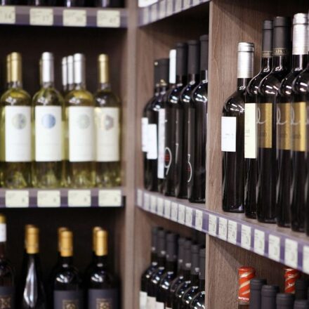 Wine bottles on shelves in shop