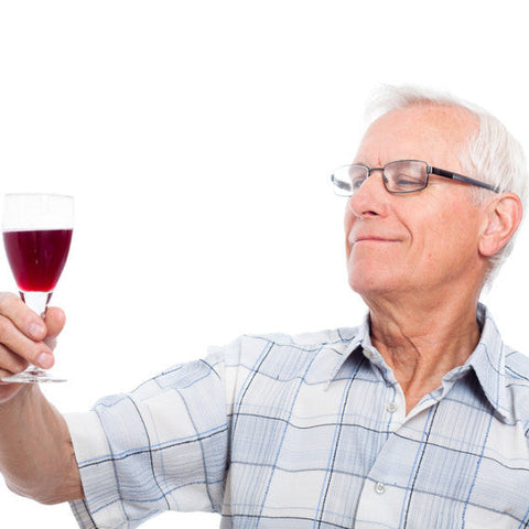 Man holding red wine glass